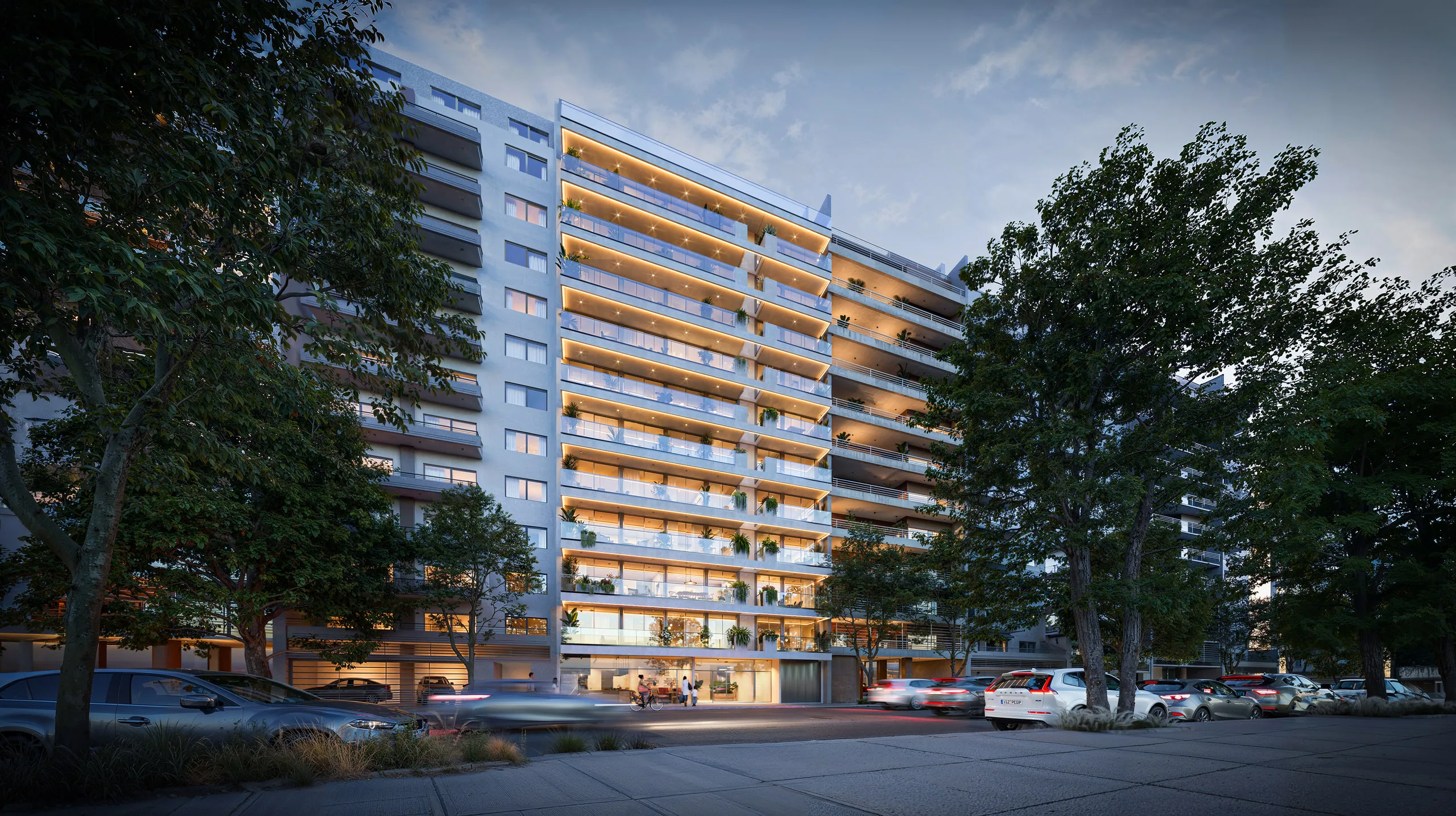 CUBIQA render: the TIER Avenue façade at dusk, its balconies lit up over the avenue